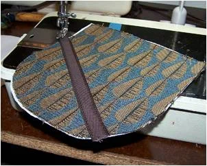 Theresa's workroom showing woven textile mounted on loom with mudcloth pattern